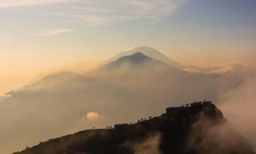volcano, mount batur, mount abang, mount agung, bali, indonesia, sunrise, landscape, outdoor, kintamani, clouds, people, nature, mountain, hiking, brown mountain, brown sunrise